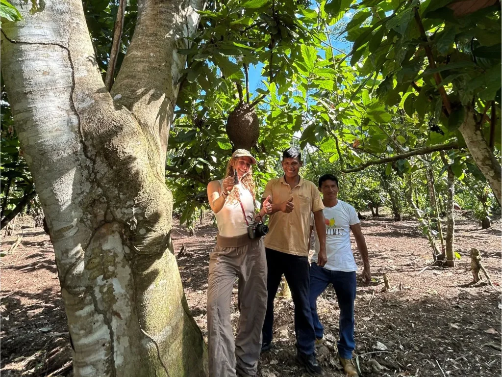 Valeria del Busto, Head of Sustainability at Amazon Andes, standing with local farmers near a Croton lechleri tree in Datem del Marañón Valeria del Busto, Head of Sustainability at Amazon Andes, standing with local farmers near a Croton lechleri tree in Datem del Marañón