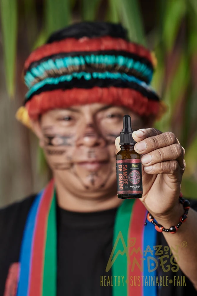 Local farmer from the amazon showcasing dragon's blood resin product. Local farmer from the amazon showcasing dragon's blood resin product.